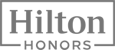 The image shows the Hilton Honors logo, featuring the words "Hilton Honors" framed within a rectangular border.
